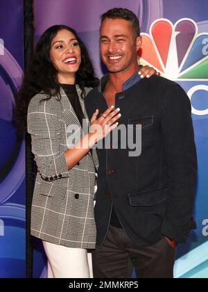 Miranda Rae Mayo and Taylor Kinney of " Chicago Fire" attend the NBC