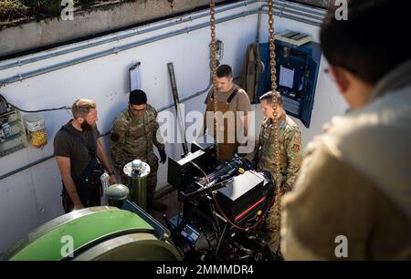 Members from the 786th Civil Engineer Squadron install a component for the overhaul of the Barrier Arresting Kit-12 at Ramstein Air Base, Germany, Sept. 20, 2022. The BAK-12 ensures fighter aircraft, or any aircraft equipped with a tailhook, come to a complete stop if a pilot is unable to land the aircraft safely on their own. Stock Photo