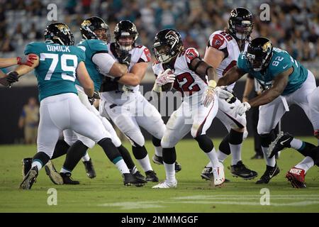 Jacksonville Jaguars defensive lineman Calais Campbell (93) and defensive  end Hunter Dimick (79) walk to the field before an NFL football practice,  Friday, May 26, 2017, in Jacksonville, Fla. (AP Photo/John Raoux