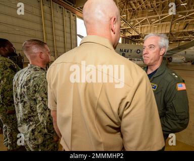 JACKSONVILLE, Fla. (Sept. 21, 2022) Rear Adm. John F. Meier, commander, Naval Air Force Atlantic, from Export, Pa., right, Speaks with Sailors from various Squadrons during a routine visit to Patrol Squadron (VP) 30 headquarters, Sept. 21. VP 30, based in Jacksonville Fla., is the U.S. Navy’s Maritime Patrol and Reconnaissance Fleet Replacement Squadron (FRS).  VP 30’s mission is to provide P-3C Orion maritime patrol aircraft, P-8A Poseidon maritime patrol aircraft and MQ-4C Triton Unmanned Aircraft System (UAS) specific training to pilots, Naval flight officers, and enlisted aircrew prior to Stock Photo