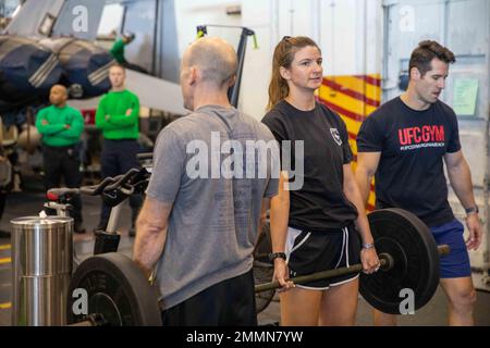 220921-N-IX644-1097 ADRIATIC SEA (Sept. 21, 2022) Lt. Kelly Boudiette, from Asheville, North Carolina, assigned to Strike Fighter Squadron (VFA) 103, holds a deadlift with Cmdr. Jason Papadopoulos, from Austin, Texas, commanding officer of VFA-103 during the VFA-103 Warrior Challenge aboard the Nimitz-class aircraft carrier USS George H.W. Bush (CVN 77), Sept. 21, 2022. The George H.W. Bush Carrier Strike Group is on a scheduled deployment in the U.S. Naval Forces Europe area of operations, employed by U.S. Sixth Fleet to defend U.S., allied and partner interests. Stock Photo