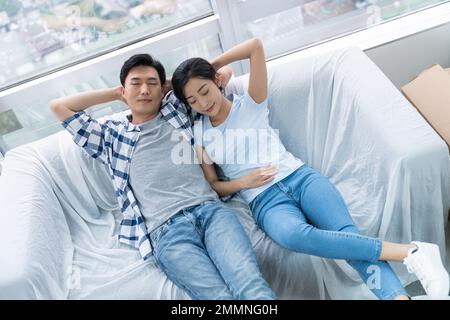 The young couple moved into a new home Stock Photo