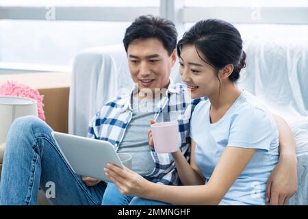 The young couple moved into a new home Stock Photo