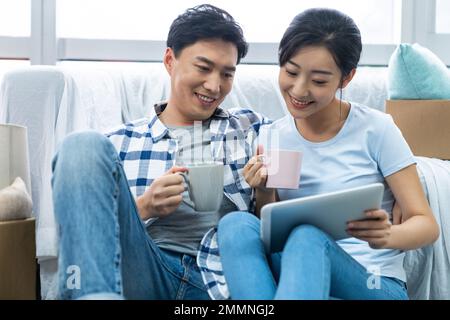The young couple moved into a new home Stock Photo