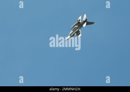 NAKHON PATHOM, THAILAND - January 14, 2023 : stunt flying, the performance of aerial feats requiring great skill or daring, Military F16 fighter jet Stock Photo