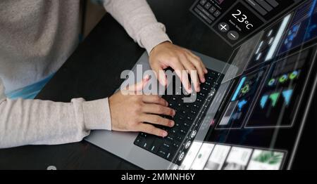 Man, hands and laptop hologram with dashboard, data analysis and software for network innovation. Above, computer typing and digital overlay for Stock Photo
