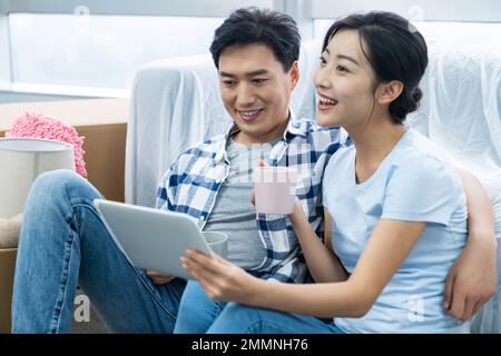 The young couple moved into a new home Stock Photo