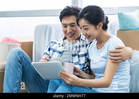 The young couple moved into a new home Stock Photo