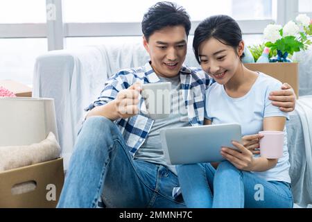 The young couple moved into a new home Stock Photo