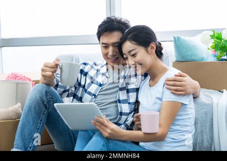 The young couple moved into a new home Stock Photo