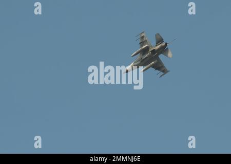 NAKHON PATHOM, THAILAND - January 14, 2023 : stunt flying, the performance of aerial feats requiring great skill or daring, Military F16 fighter jet Stock Photo