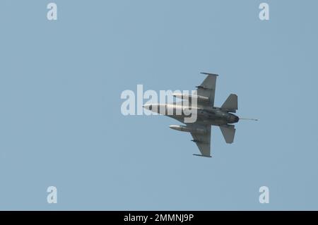 NAKHON PATHOM, THAILAND - January 14, 2023 : stunt flying, the performance of aerial feats requiring great skill or daring, Military F16 fighter jet Stock Photo