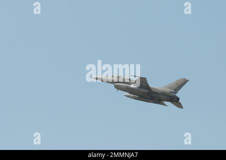 NAKHON PATHOM, THAILAND - January 14, 2023 : stunt flying, the performance of aerial feats requiring great skill or daring, Military F16 fighter jet Stock Photo