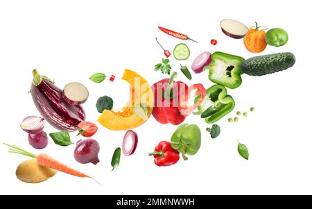 Flying ripe vegetables on white background Stock Photo