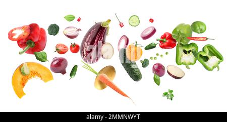 Flying organic vegetables on white background Stock Photo