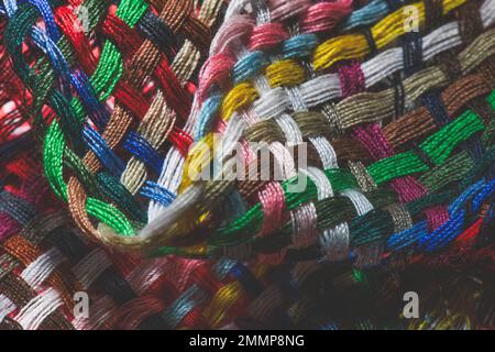 Close-up of multicolored woven sewing threads Stock Photo