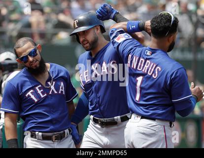 Texas Rangers' Delino DeShields (left), Texas Rangers' Joey Gallo (center)  and Washington Nationals' Bryce Harper (right) socialize prior to a  baseball game against the Texas Rangers, Sunday, June 11, 2017, in  Washington. (