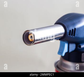 Gas can with manual torch burner blowtorch isolated on white background. Stock Photo