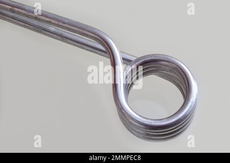Immersion heater with a shadow on a light background. Stock Photo