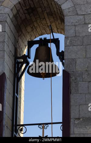 Large Church bell hanging outside. Close-up view of metal orthodox church bell. Stock Photo
