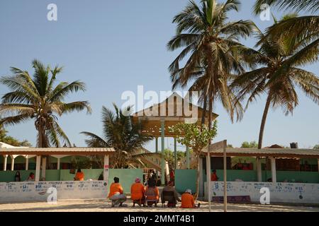The 'Fruit Ladies' selling fruit at Kotu market. Kotu beach, The Gambia. A popular holiday destination for European tourists. Stock Photo