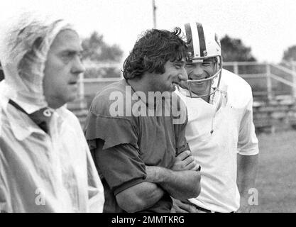 New York Jets John Riggins goes through the motions of a fake handoff  during training session at Rikers Island in New York City, Sept. 26, 1973.  He arrived for training sporting a