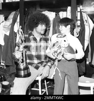 New York Jets John Riggins goes through the motions of a fake handoff  during training session at Rikers Island in New York City, Sept. 26, 1973.  He arrived for training sporting a