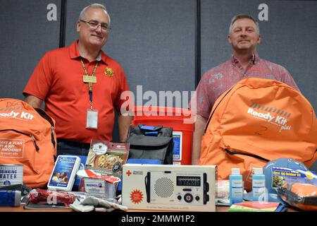 Tom Janis, left, emergency manager for U.S. Army Garrison Presidio of Monterey, and Tom Davis, USAG PoM antiterrorism officer, display examples of items they hope community members will keep on hand in case of emergency. Stock Photo