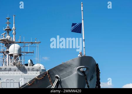 220923-N-NU634-088    NORFOLK (Oct. 23, 2022) – The Union Jack is lowered for the final time during the decommissioning ceremony of the Ticonderoga-class, guided-missile cruiser USS Hué City (CG 66) after 31 years of naval service. Following decommissioning, the ship is slated to be towed to the Navy’s Inactive Ship’s facility in Philadelphia, Pa., where it will be in a Logistical Support Asset status. Stock Photo
