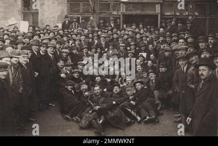 Vintage drinking / life event / celebrations / family photo / friends photo / vintage trip / vintage celebration / group photo / vintage family / vintage cheers / vintage wine /vintage beer /  vintage friends / vintage party / vintage celebration / vintage family /  Additional-Rights-Clearences-Not Available An early 20th century view of an factory labour mass photo. Stock Photo