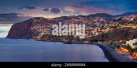 Funchal city at night near Praia Formosa beach, Madeira - Portugal Stock Photo