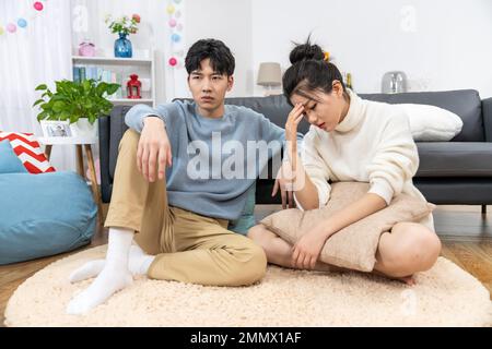 Young lovers quarrel on the sofa in the sitting room Stock Photo - Alamy