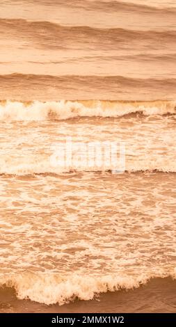 Real photo sea water waves, abstract background, nature power, bright orange brown more tone in stock Stock Photo
