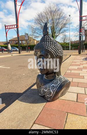 Buddha head for sale displayed in road ouitside Barras Market, Glasgow, Scotland Stock Photo