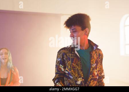 Image of happy biracial male dancer in dance studio. Dance, rhythm, movement and training concept. Stock Photo