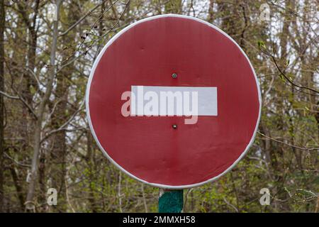 Road Sign STOP, stop brick, forbidding sign at the entrance to the forest or Park, prohibition of movement in the forest, prohibition of passage to th Stock Photo