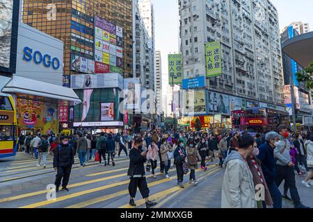 Hong Kong December 2022 - Busy street intersection and zebra crossing in Causeway Bay Stock Photo