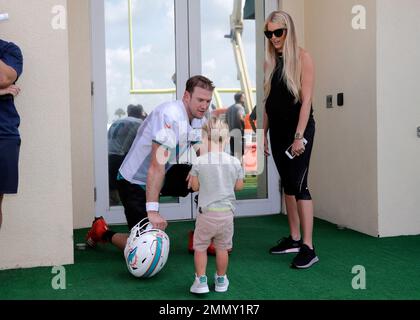 Lauren Tannehill, wife of AFC quarterback Ryan Tannehill of the Tennessee  Titans, carries their daughter, Stella Rose Tannehill, on the field during  warmups before the NFL Pro Bowl football game against the