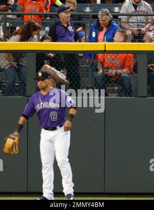 Fan interferes with ball during Astros-Rockies