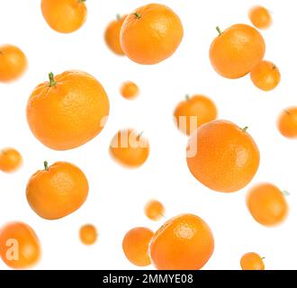 Set of falling fresh juicy tangerines on white background Stock Photo