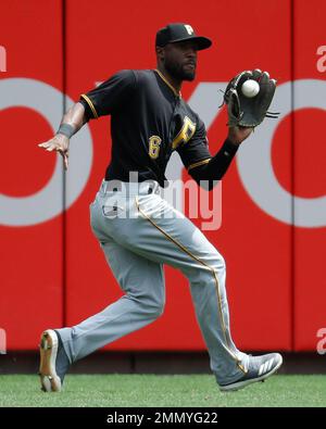 Milwaukee, USA. August 24, 2018: Pittsburgh Pirates center fielder Starling  Marte #6 along with the Brewer infielders watch the review challenge on the  jumbo screen of Martes stolen base in the 11th