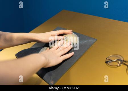 Woman's hands touches exposition in museum. Convex exhibit for visually impaired and blind people. Braille and accessibility for disabilities people. Stock Photo