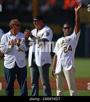 Oakland Athletics Rickey Henderson waves to the crowd during a