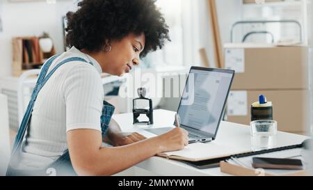Planning, writing and black woman working on company or business schedule, work calendar and meeting agenda. Receptionist, employee or worker with Stock Photo