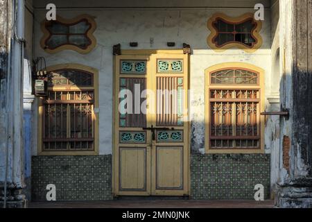 Georgetown, Penang, Malaysia - November 2012: Vintage door and windows with grills of a traditional house in the heritage town of Penang. Stock Photo