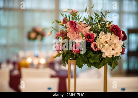 Wedding flowers set up in a restaurant. A wedding colorful bouquet. High quality photo Stock Photo