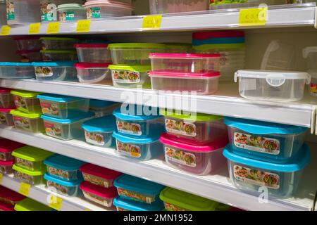 Italy - January 28, 2023: Clear and colored rubber and plastic food boxes for sale on the shelves of an Italian discount supermarket Stock Photo