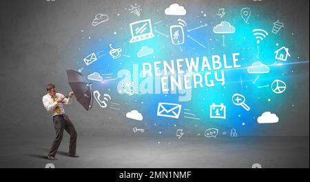 Businessman defending with umbrella, modern technology concept Stock Photo