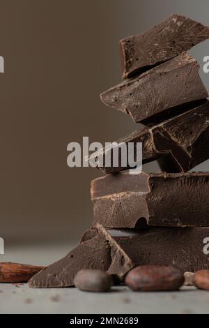 mound of dark chocolate on a gray background Stock Photo