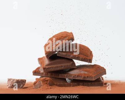 chocolate with falling cocoa powder Stock Photo